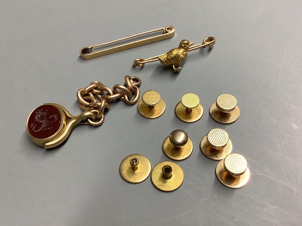 Three yellow metal dress studs, five gold plated dress studs, a 9ct chick bar brooch, a 15ct tie pin and a chalcedony set bob seal on a yellow metal chain